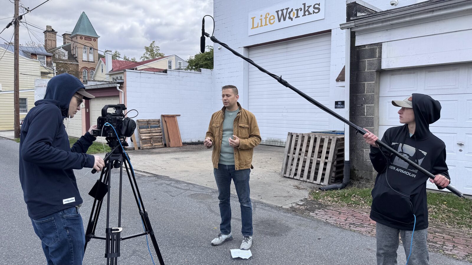 A Bridge Productions crew filming on location outside LifeWorks
